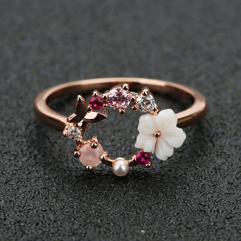 anillo rosado con flores 