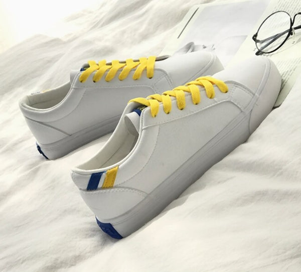 zapatillas deportivas blancas amarillas