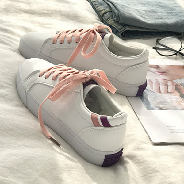 zapatillas deportivas blancas rosas